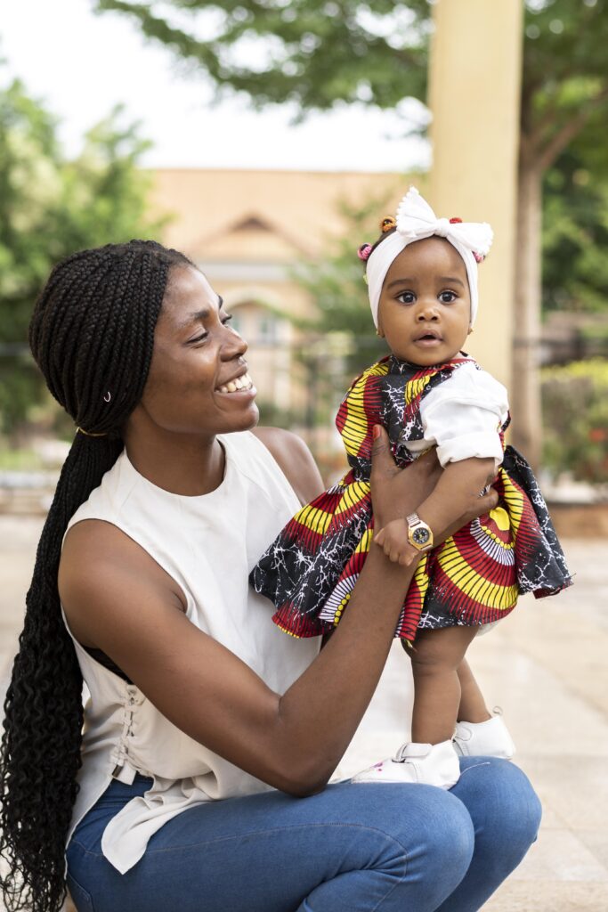 african-woman-holding-little-girl